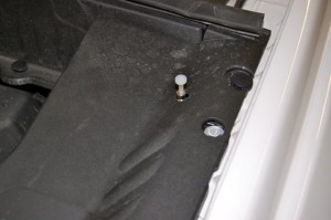 A properly installed vehicle hood pin