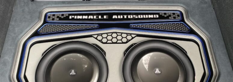 A pinnacle Autosound speaker set installed in the trunk of a vehicle