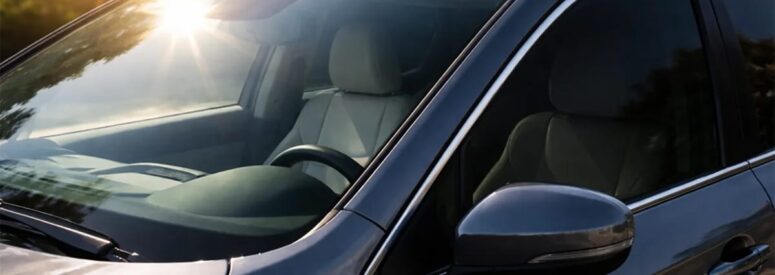 A car without window tint in the sun